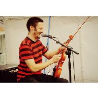 Violinist. Rapper. Menace. Mike Dennis.